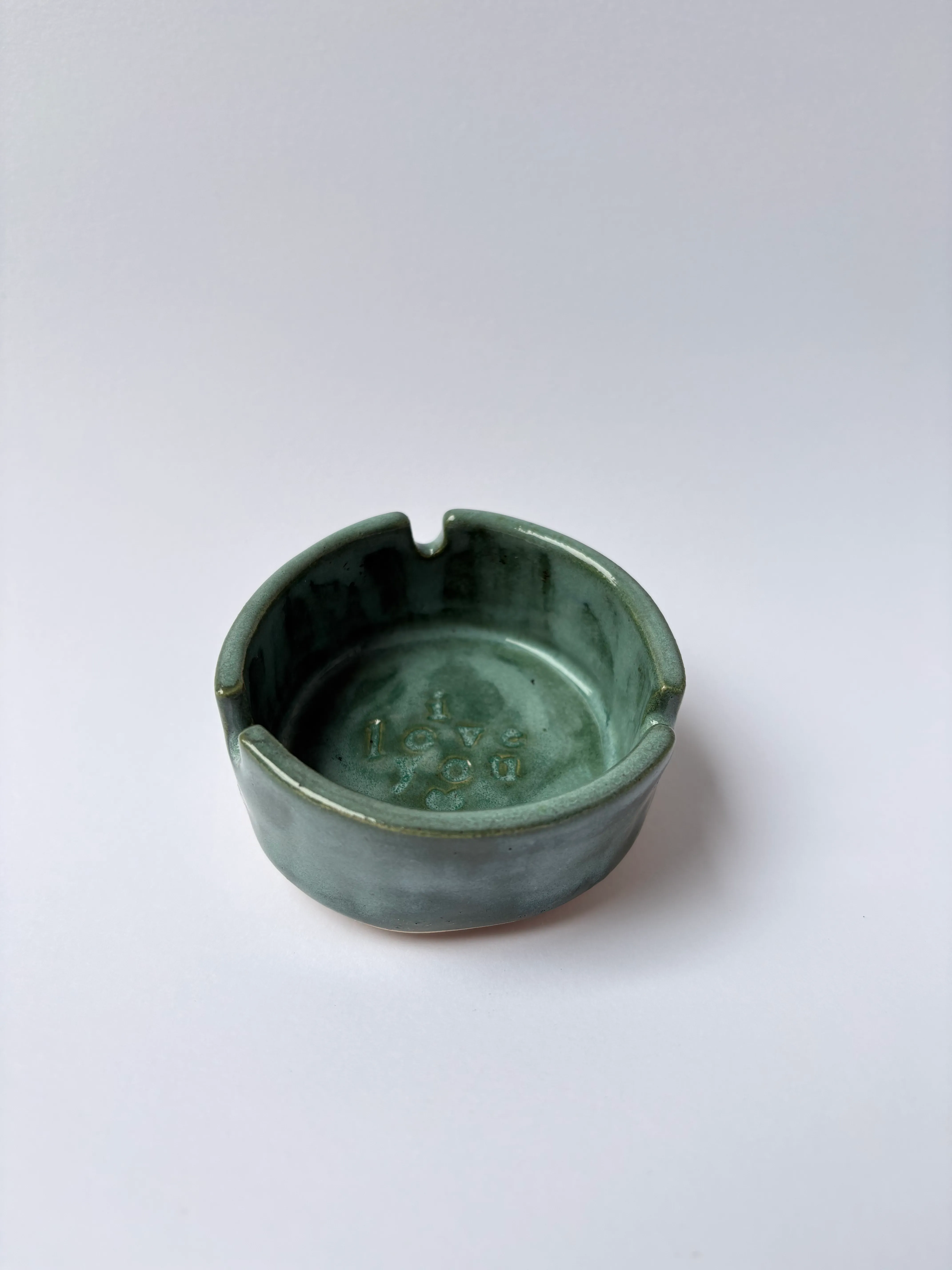 Tiny ashtray cup